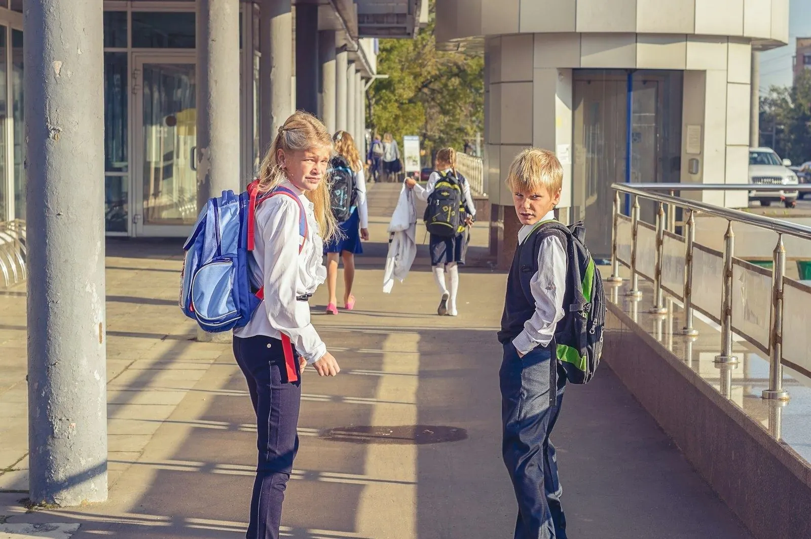Children with school backpacks on their way to class